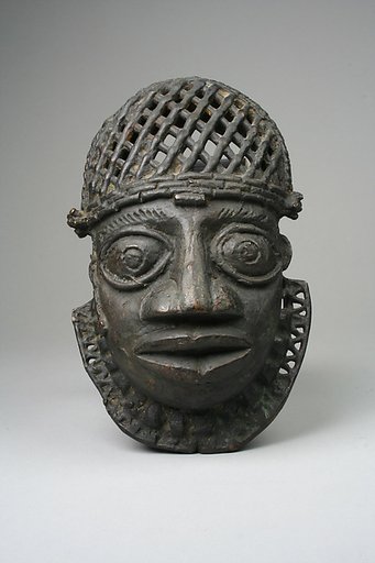 Hip ornament with face