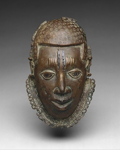 Pectoral ornament with face