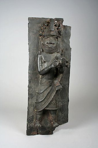 Plaque with titleholder with calabash rattle