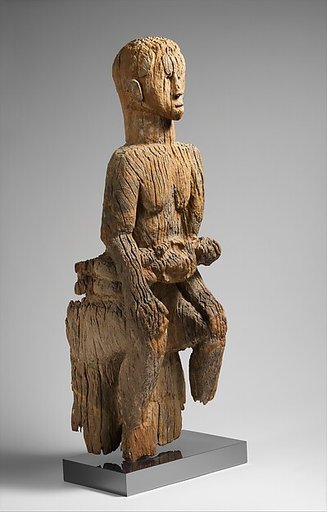 Seated mother and child from an ikoro drum(?)