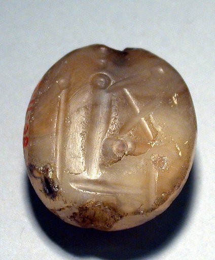 Stamp seal (scaraboid with pointed top) with deity (?)