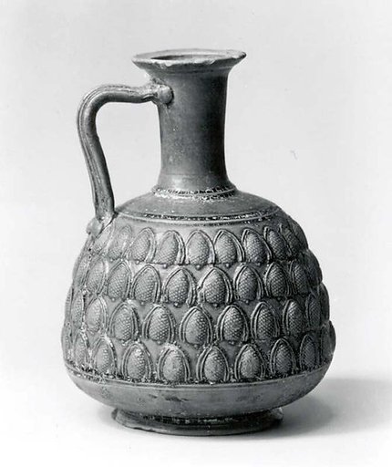 Vessel decorated with four rows of pine cones