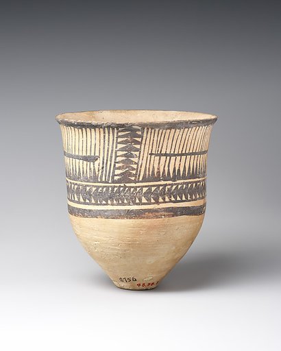 Beaker with geometric decoration