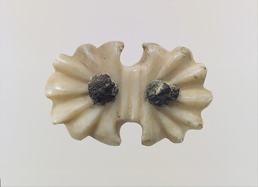 Ornament or button for harness