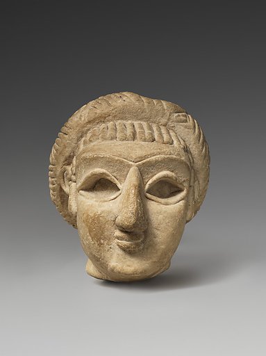 Female head with elaborate hairstyle