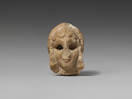 Female head with elaborate hairstyle