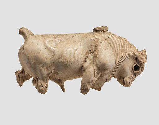 Furniture or cosmetic box plaque carved in the round with striding bull