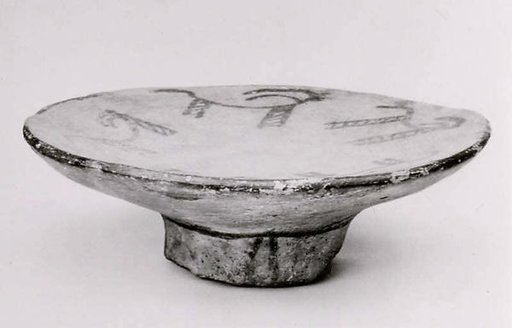 Footed plate with horned animals