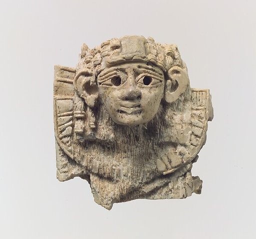Openwork furniture plaque with head of a sphinx