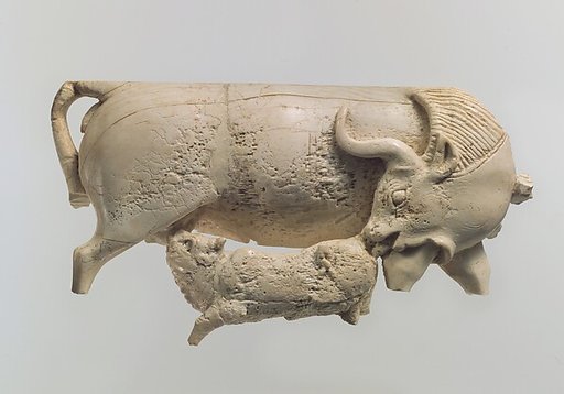 Openwork furniture plaque showing a cow suckling a calf