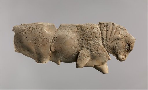 Openwork furniture plaque with a striding bull