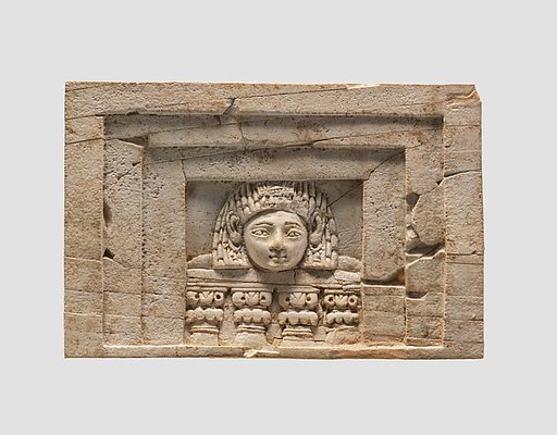 Furniture plaque carved in relief with a “woman at the window”
