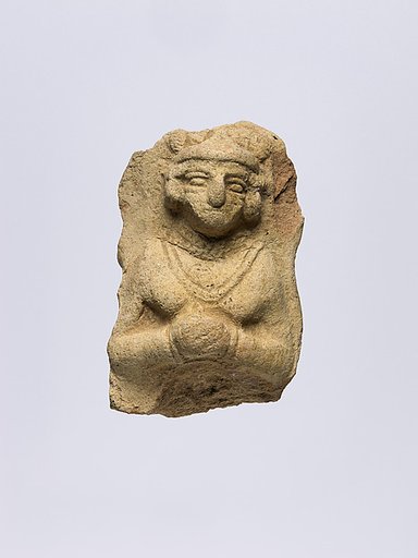 Female figure wearing jewelry