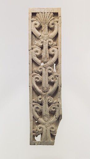 Furniture plaque carved in relief with volutes and a palmette
