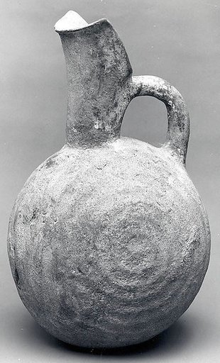 Spouted jug with raised concentric circles