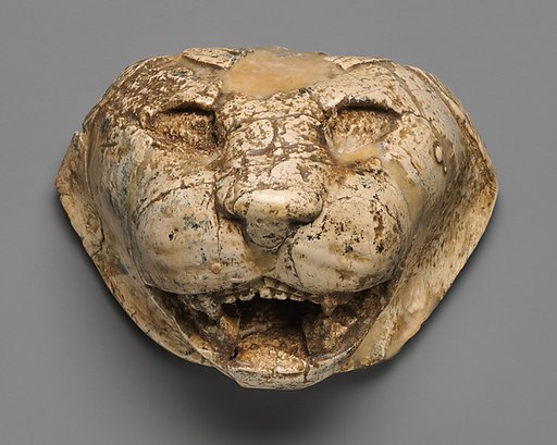 Lion's head carved in the round