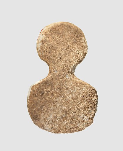 Spade-shaped schematic female (?) figure