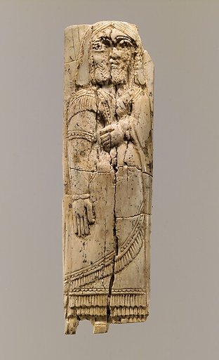 Furniture plaque with figure in relief