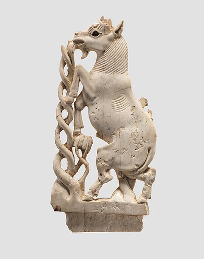 Openwork furniture plaque with a rearing goat