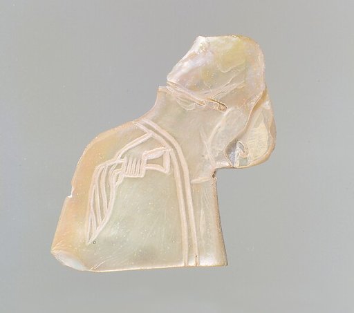 Inlay: banquet scene with a seated figure holding a palm frond