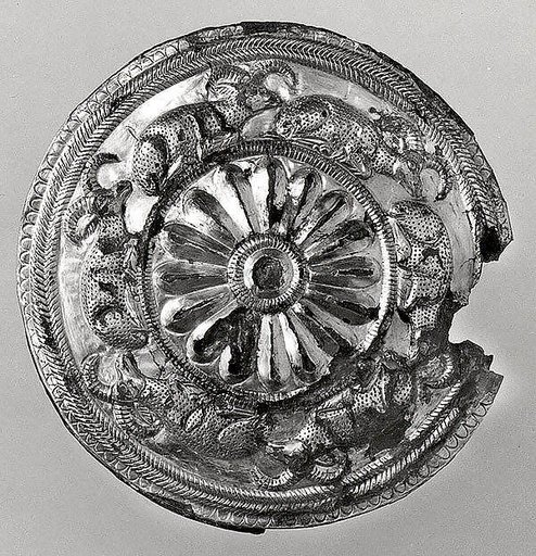 Roundel with a rosette and recumbent horned animals