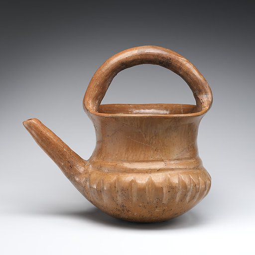 Spouted jar with a basket handle