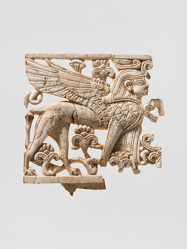 Openwork plaque with a sphinx striding through a floral landscape