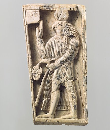 Furniture plaque carved in relief with a falcon-headed figure