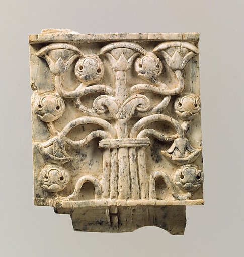 Furniture plaque carved in relief with stylized tree