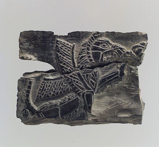 Plaque with a seated, winged leonine monster  possibly with scorpion tail
