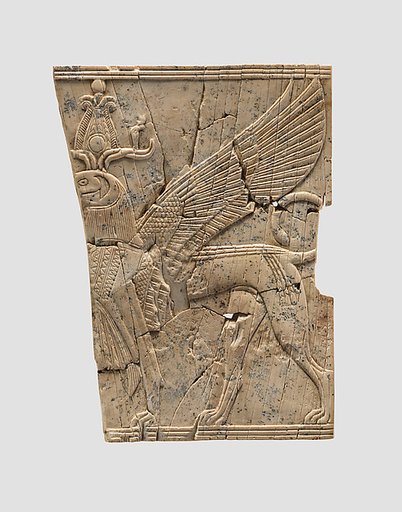 Furniture plaque carved in relief with a winged, falcon-headed sphinx