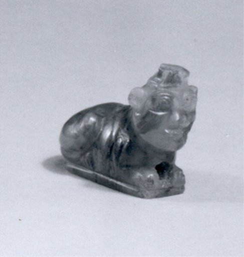 Lion amulet with human head