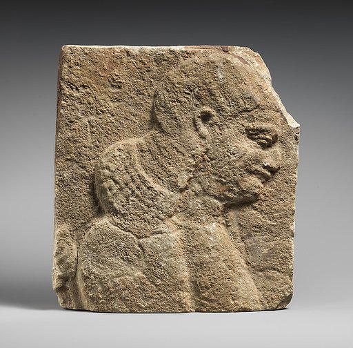 Relief: head and shoulders of a beardless man, possibly a eunuch