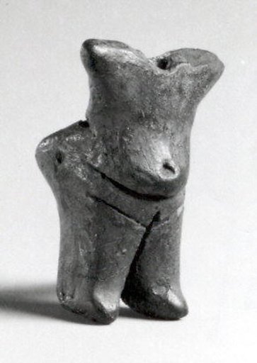 Standing female (with a hole for attachment of the head, now missing)