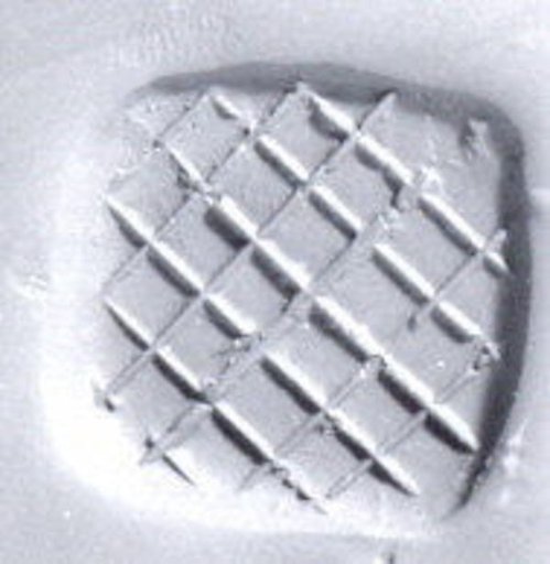 Loop (?) handled rectangular stamping device