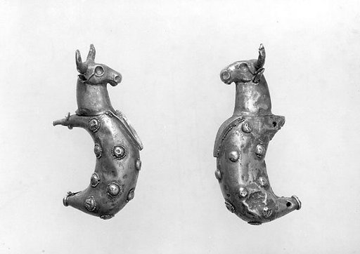 Crescent-shaped attachments with bulls' heads