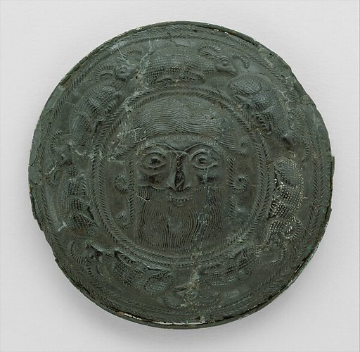 Roundel with head of a "hero" surrounded by caprids