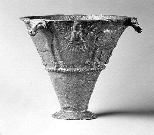 Conical beaker with relief decoration of bovines and birds of prey