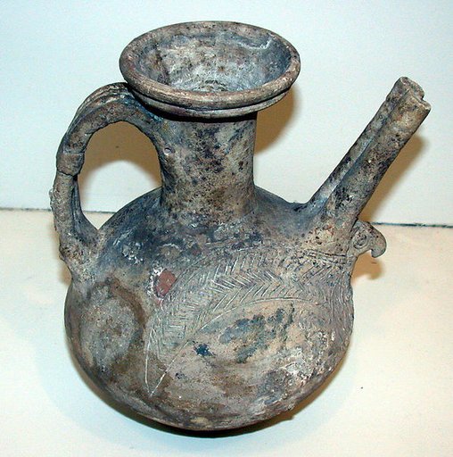 Spouted jar with eagle incised in high relief