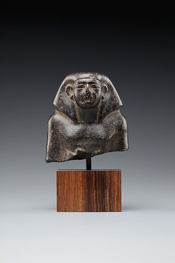 Head and Upper Torso of a Seated Official
