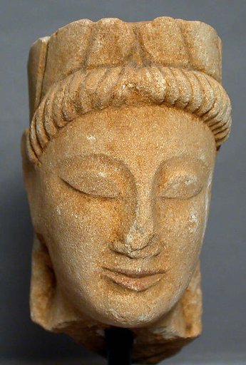 Limestone male head with wreath