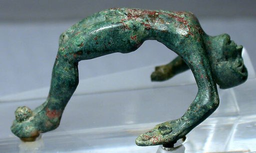 Bronze handle of a cista with nude youth