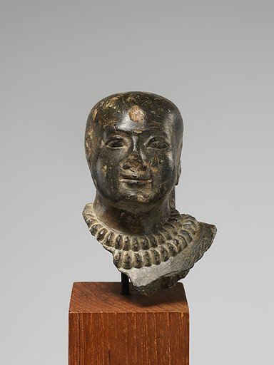 Bald-headed Man Wearing Gold Collars
