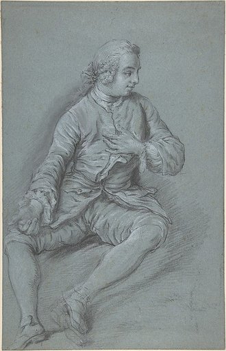 Young Man Seated on the ground with his left hand at his chest