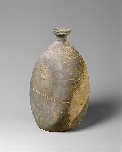 Bottle with flattened side