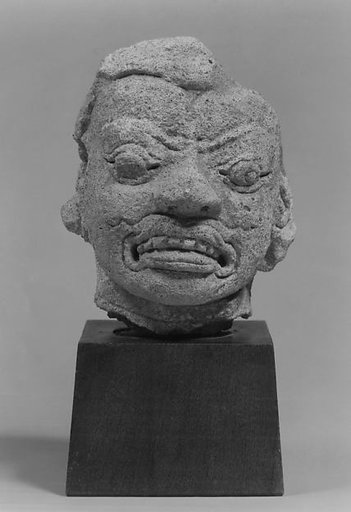 Head of a Grimacing Male Deity