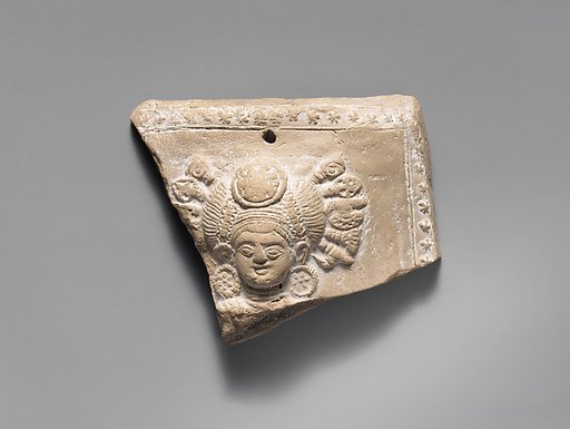 Head of a Goddess with Weapons in her Hair
