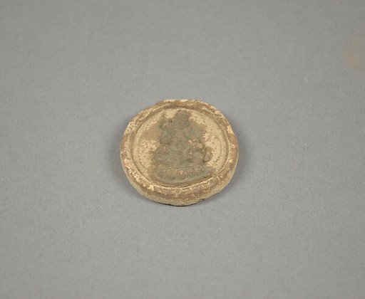 Votive Plaque with Seated Figure