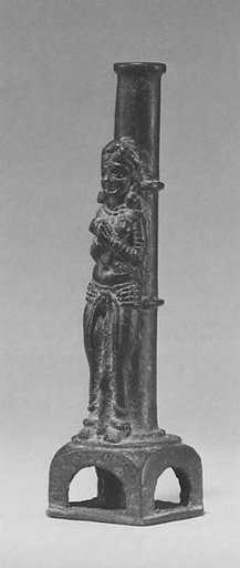 Female Worshipper in Front of a Column Support