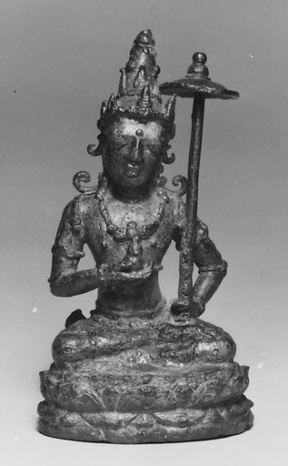Seated Male Deity Holding a Parasol and an Unidentified Object